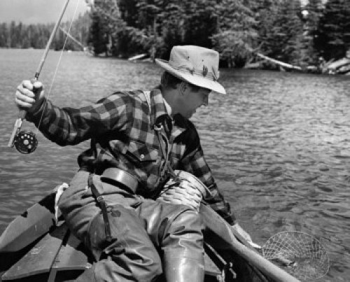 Close-up of a young man fishing for trout in a lake  Yellowstone Lake  Yellowstone National Park  Wyoming  USA Poster Print - Item # VARSAL25518580B