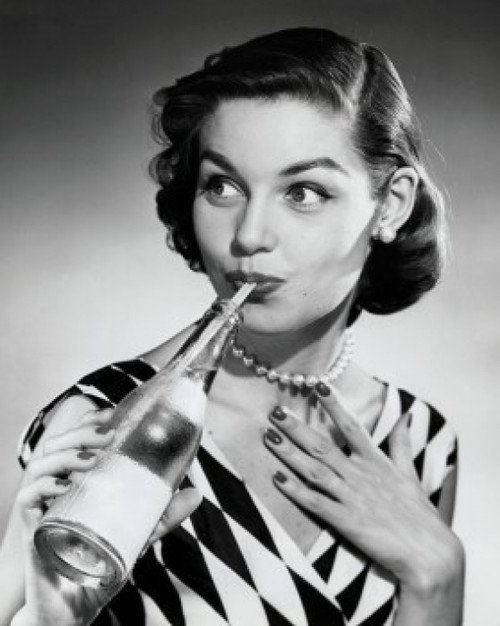 Close-up of a young woman drinking from soda bottle with a drinking straw Poster Print - Item # VARSAL25512665