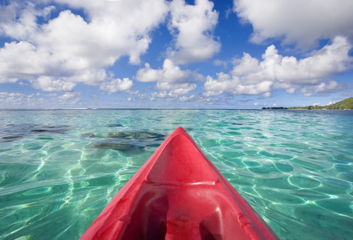 French Polynesia, Tahiti, Bora Bora, Red Outrigger Canoe In Calm Turquoise Water. PosterPrint - Item # VARDPI1975866