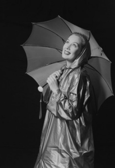 Young woman holding umbrella and wearing raincoat Poster Print - Item # VARSAL255422906C