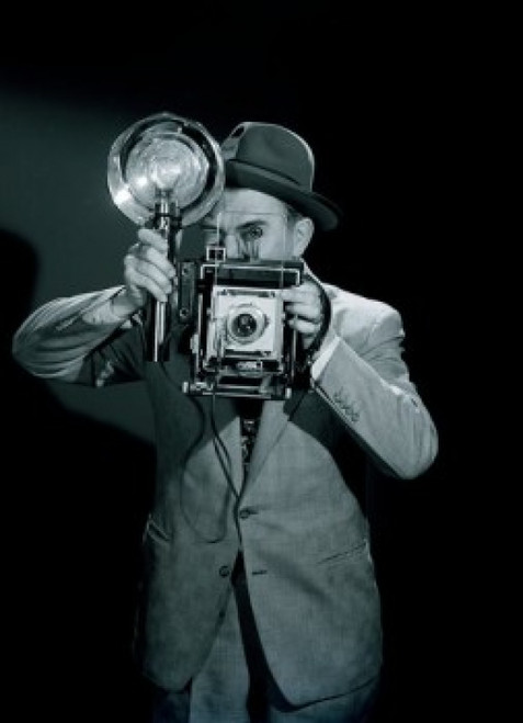Studio portrait of photographer holding camera Poster Print - Item # VARSAL255417283