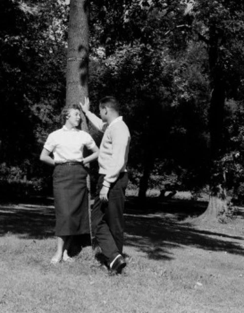 Young couple talking in park Poster Print - Item # VARSAL255422124