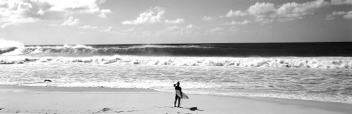 Surfer standing on the beach, North Shore, Oahu, Hawaii, USA Poster Print - Item # VARPPI172555