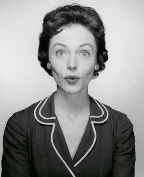 Studio portrait of young woman puckering Poster Print - Item # VARSAL25510548