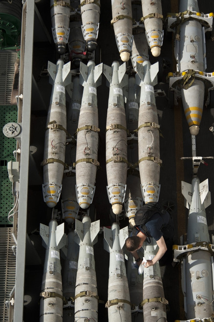 Gulf of Oman, June 22, 2013 - A Sailor maintains and cleans ordnance aboard the aircraft carrier USS Nimitz Poster Print - Item # VARPSTSTK107657M