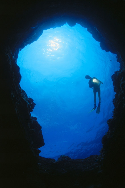 Hawaii, Silhouetted Diver At Cavern Entrance With Flashlight, Sunburst PosterPrint - Item # VARDPI1999575