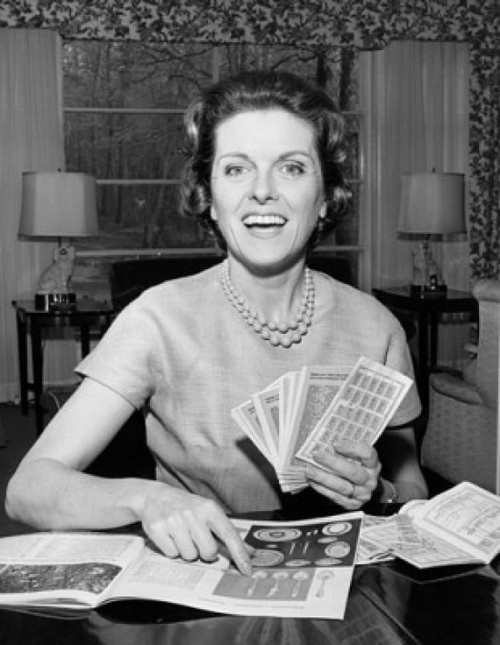 Young woman holding coupons and smiling Poster Print - Item # VARSAL25543701