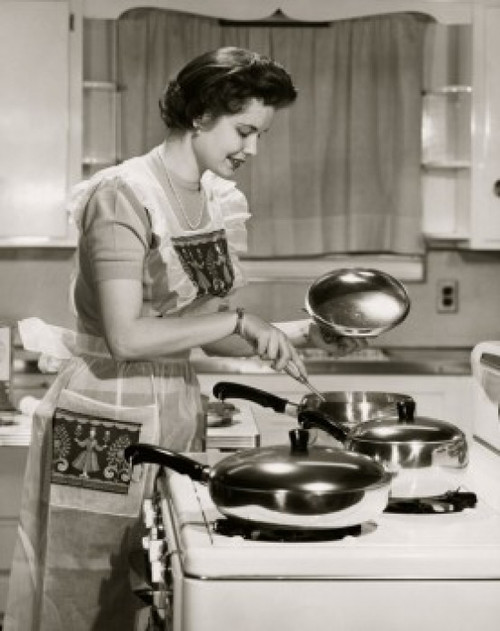 Side profile of a young woman cooking food in the kitchen Poster Print - Item # VARSAL2553334