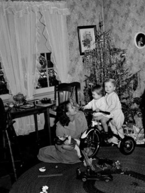 Children on tricycle by Christmas tree  mother looking Poster Print - Item # VARSAL255416906