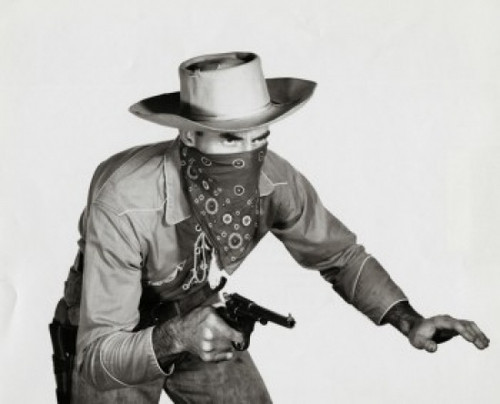 Close-up of a cowboy holding a pistol Poster Print - Item # VARSAL25518685
