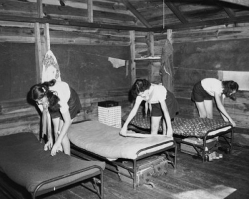 Three girls making beds in a camp Poster Print - Item # VARSAL25516993