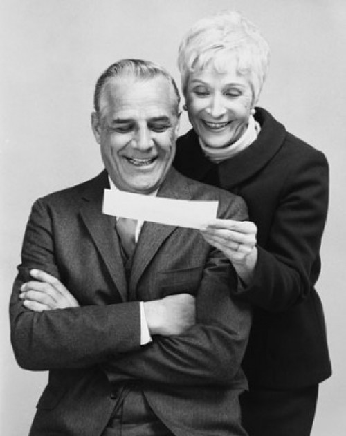Close-up of a senior couple looking at a check and smiling Poster Print - Item # VARSAL25519151B