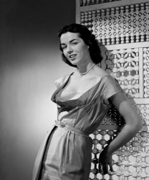 Portrait of young woman leaning against screen partition Poster Print - Item # VARSAL255417112B