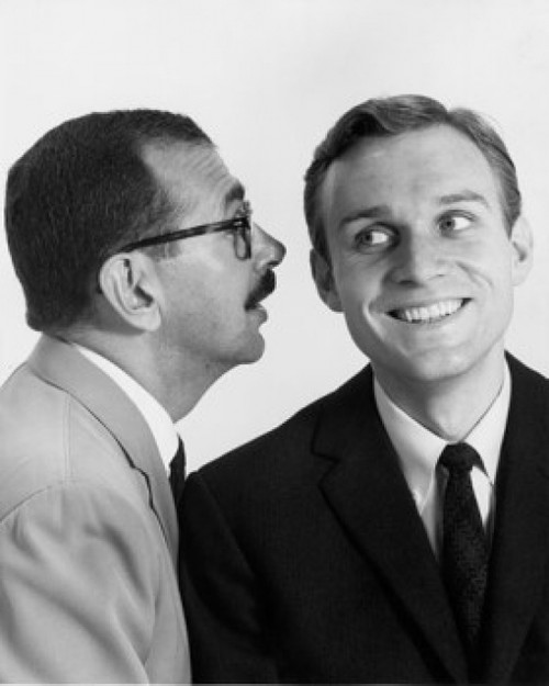 Businessman whispering to another businessman Poster Print - Item # VARSAL25548067