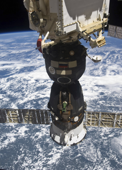 July 9, 2010 - The Soyuz TMA-19 spacecraft docked to the Rassvet Mini-Research Module 1. A blue and white part of Earth and the blackness of space provide the backdrop for the scene. Poster Print - Item # VARPSTSTK203485S