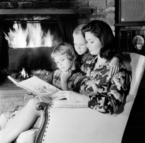 Mother  daughter and son reading book in living room Poster Print - Item # VARSAL255418598