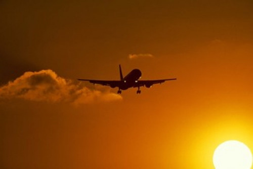 Silhouette of airliner in golden sunset Poster Print by Panoramic Images (24 x 16) - Item # PPI117904