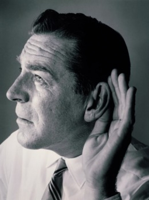 Close-up of a mature man with a cupped hand to his ear Poster Print - Item # VARSAL2554971