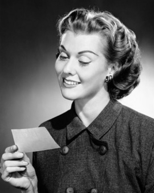 Close-up of a young woman reading a letter Poster Print - Item # VARSAL2553341