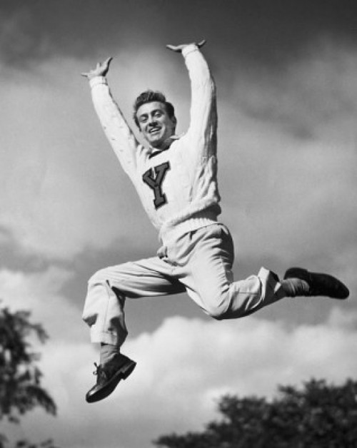 Portrait of a male cheerleader jumping and cheering Poster Print - Item # VARSAL2555055