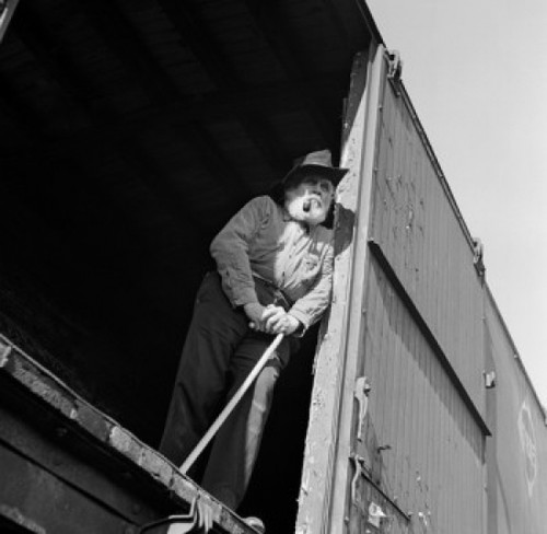 Low angle view of a senior man standing in a train car Poster Print - Item # VARSAL25544271