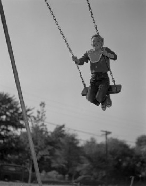 Low angle view of a boy on a swing Poster Print - Item # VARSAL2558818
