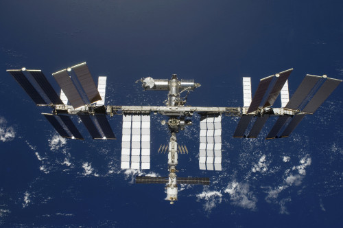 March 25, 2009 - The International Space Station, backdropped by a blue and white Earth Poster Print - Item # VARPSTSTK202580S