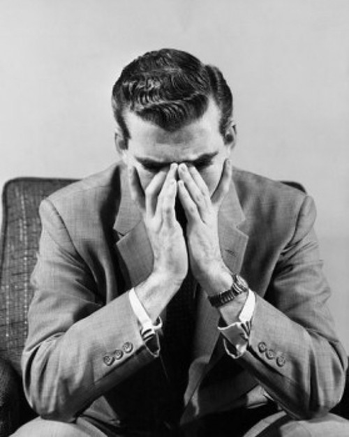Close-up of a businessman sitting with his hands covering mouth Poster Print - Item # VARSAL2553061