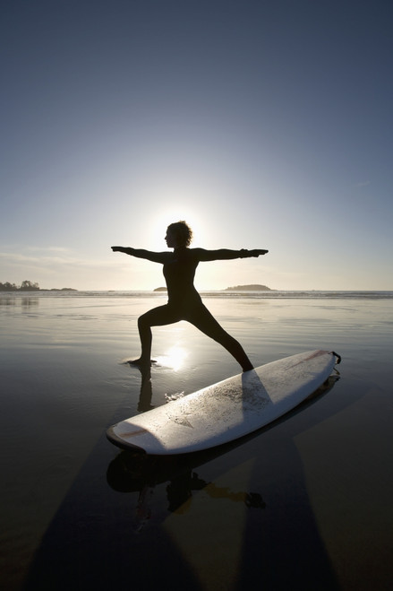 Silhouette Of Female Surfer Doing Warrior Yoga Pose; Chesterman Beach Tofino Vancouver Island British Columbia Canada PosterPrint - Item # VARDPI1938901