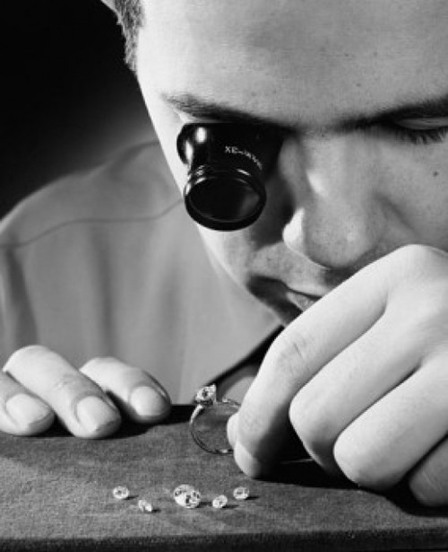 Close-up of a mid adult man inspecting diamonds Poster Print - Item # VARSAL2553575 Close-up of a mid adult man inspecting diamonds Poster Print - Item # VARSAL2553575