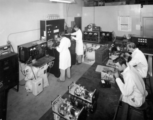 High angle view of male engineers testing electronic components Poster Print