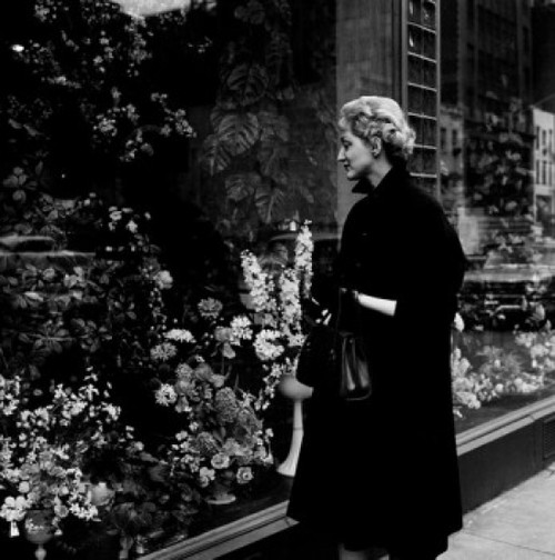 Woman watching window display with flowers Poster Print - Item # VARSAL255416974