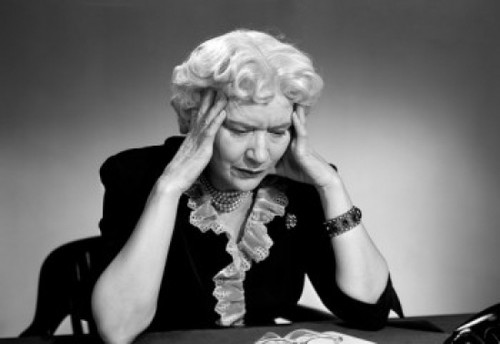 Senior woman sitting with head in hands Poster Print - Item # VARSAL2554796