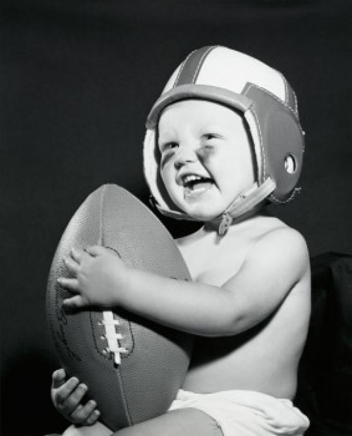 Close-up of a baby boy holding a football Poster Print - Item # VARSAL255629