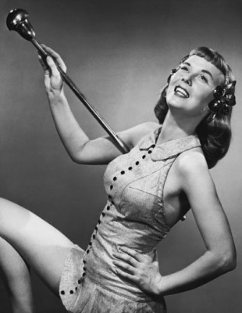 Drum majorette holding a twirling baton and smiling Poster Print - Item # VARSAL25522439B