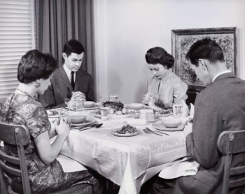 Two young couples praying before a meal Poster Print - Item # VARSAL25535694
