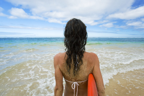 Hawaii, Kauai, Woman Holding Surfboard On Beach, View From Behind. PosterPrint - Item # VARDPI1966498