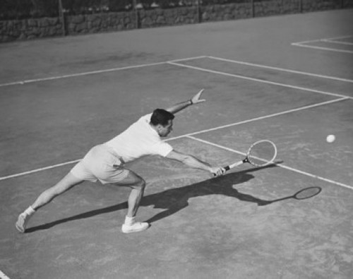 High angle view of a young man playing tennis on a tennis court Poster Print - Item # VARSAL2552601
