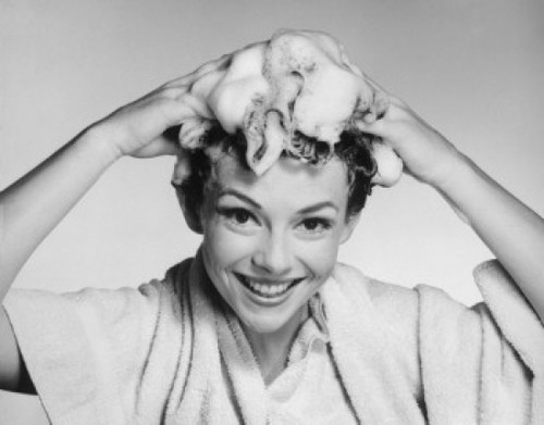 Portrait of a young woman washing her hair Poster Print - Item # VARSAL25518734