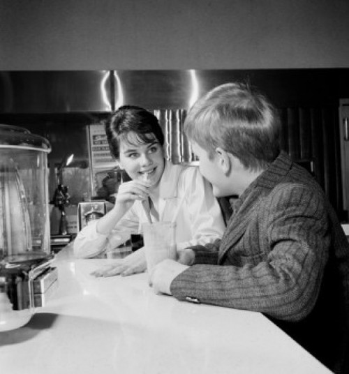 Young woman and boy sitting in restaurant Poster Print - Item # VARSAL255422674