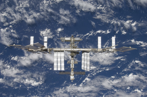 March 25, 2009 - The International Space Station, backdropped by a blue and white Earth Poster Print - Item # VARPSTSTK202583S