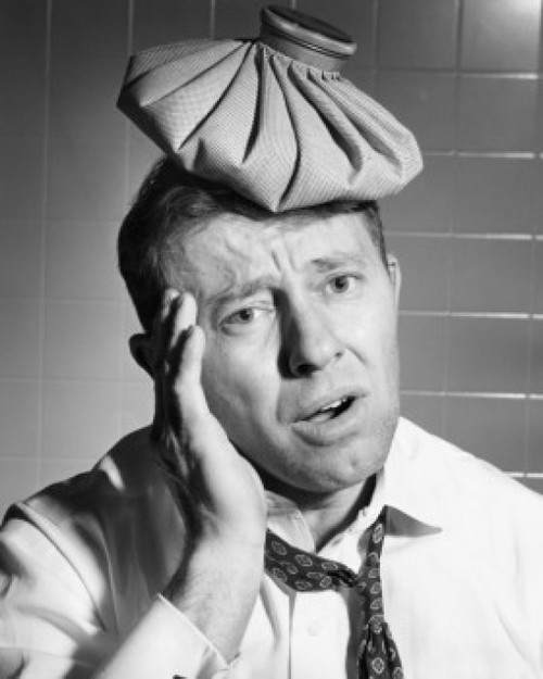 Close-up of a mature man with an ice pack on his head suffering from a headache Poster Print - Item # VARSAL25527695
