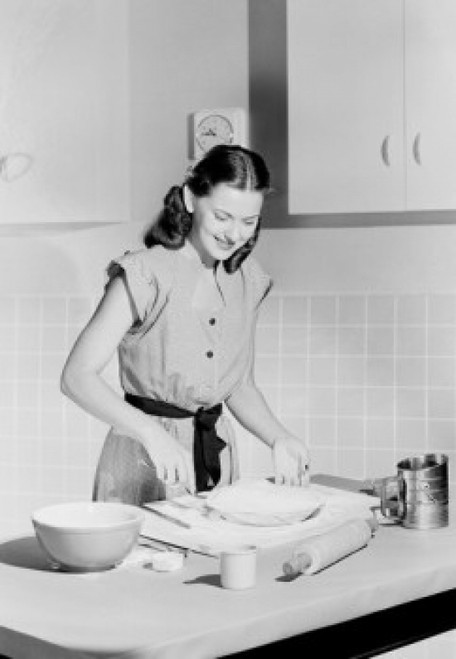 Young woman preparing cake in domestic kitchen Poster Print - Item # VARSAL255422349B