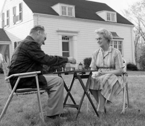 Senior couple playing board game in backyard Poster Print - Item # VARSAL25528968