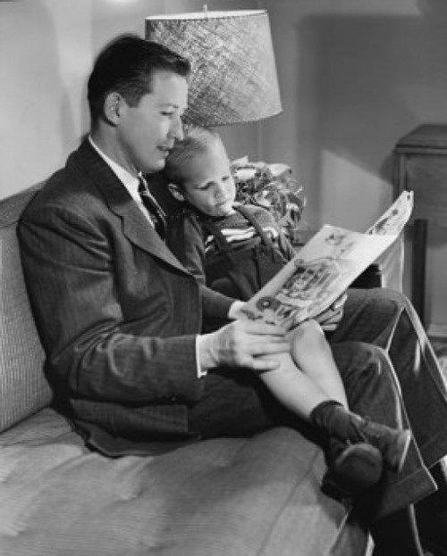 Father reading a book with his son sitting on his lap Poster Print - Item # VARSAL25516044