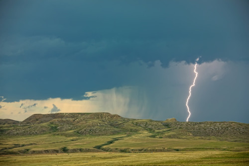 Digitally Enhanced Image With Painterly Effect Of Lightning Striking Over 70 Mile Butte And Sleeping Lion Butte, Grasslands National Park, Saskatchewan PosterPrint - Item # VARDPI2032372