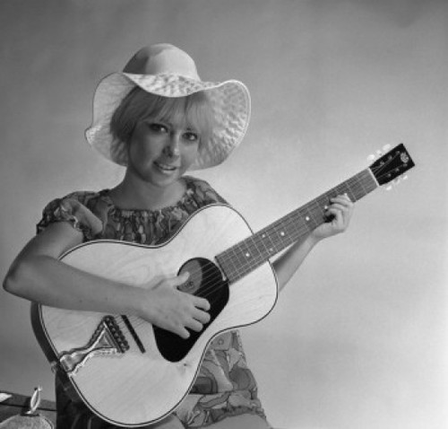 Studio portrait of young woman holding guitar Poster Print - Item # VARSAL255420923
