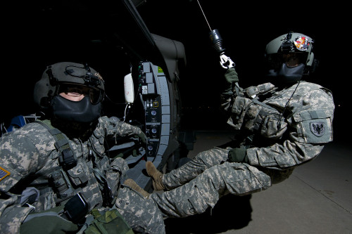 Flight medics practice with the UH-60 Blackhawk hoist at Davis-Monthan Air Force base during exercise Angel Thunder 2013 Poster Print - Item # VARPSTTMO100967M