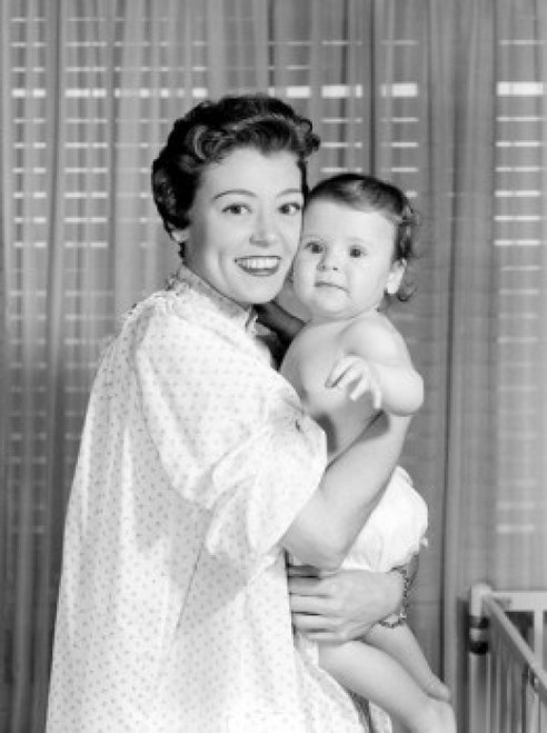Portrait of mother embracing baby in bedroom Poster Print - Item # VARSAL255416862