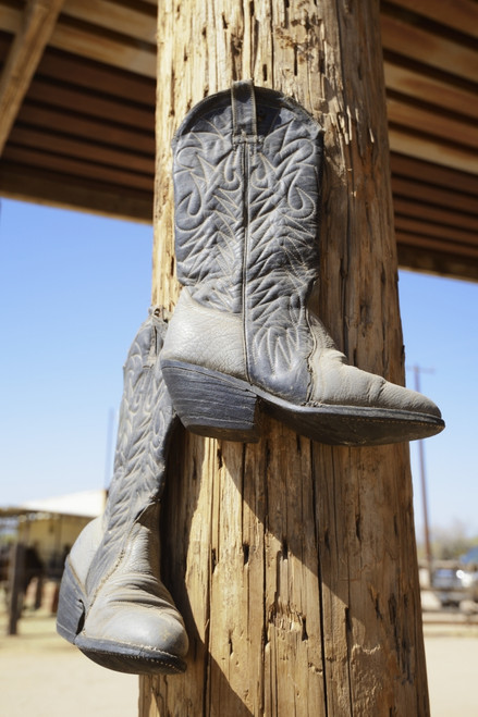 Cowboy Boots Hanging From A Post At A Riding Ranch;Arizona Usa PosterPrint